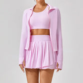 Light pink pleated skirt with matching crop top and zip-up jacket, sporty fit, soft fabric
