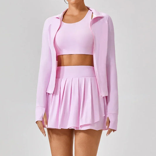 Light pink pleated skirt with matching crop top and zip-up jacket, sporty fit, soft fabric