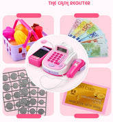 Pink and white toy cash register set with play money, coins, credit card, and grocery basket.