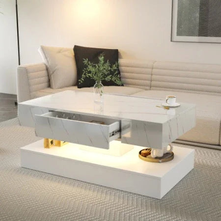 Modern white marble coffee table with hidden storage drawer and minimalist decor in living room