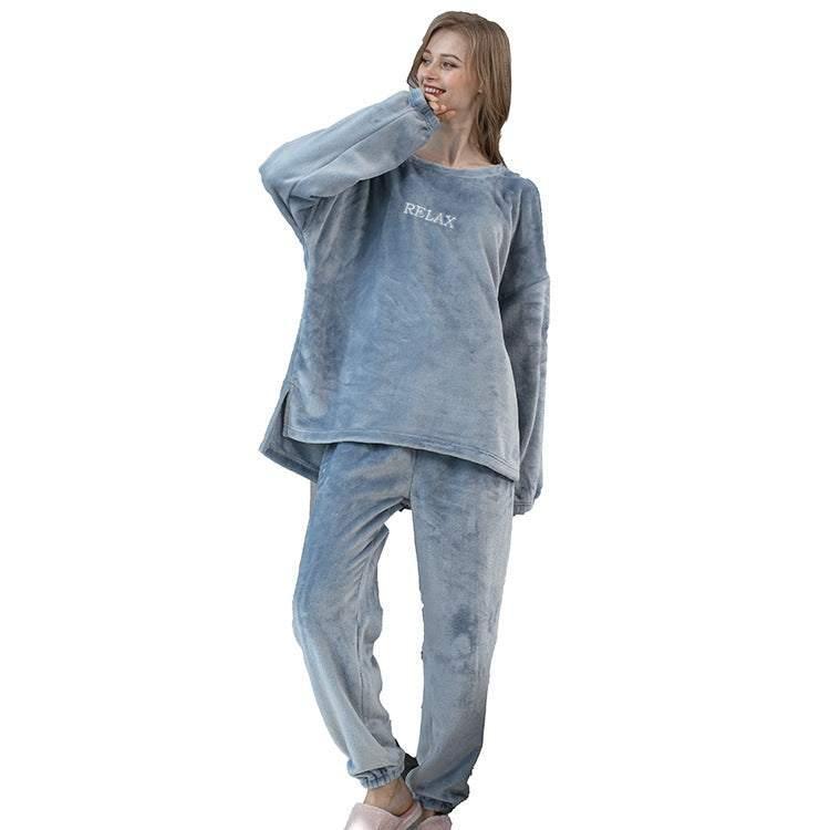Woman wearing oversized blue plush loungewear set with relaxed fit and cozy material