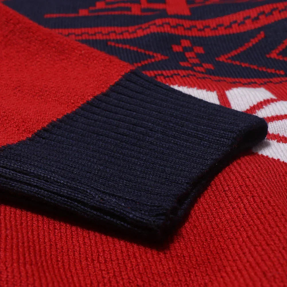 Close-up of red and navy streetwear sweater knit cuff, showing soft textured material and relaxed fit.