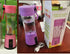 Pink and purple portable rechargeable juice blenders with plastic and glass design on a table