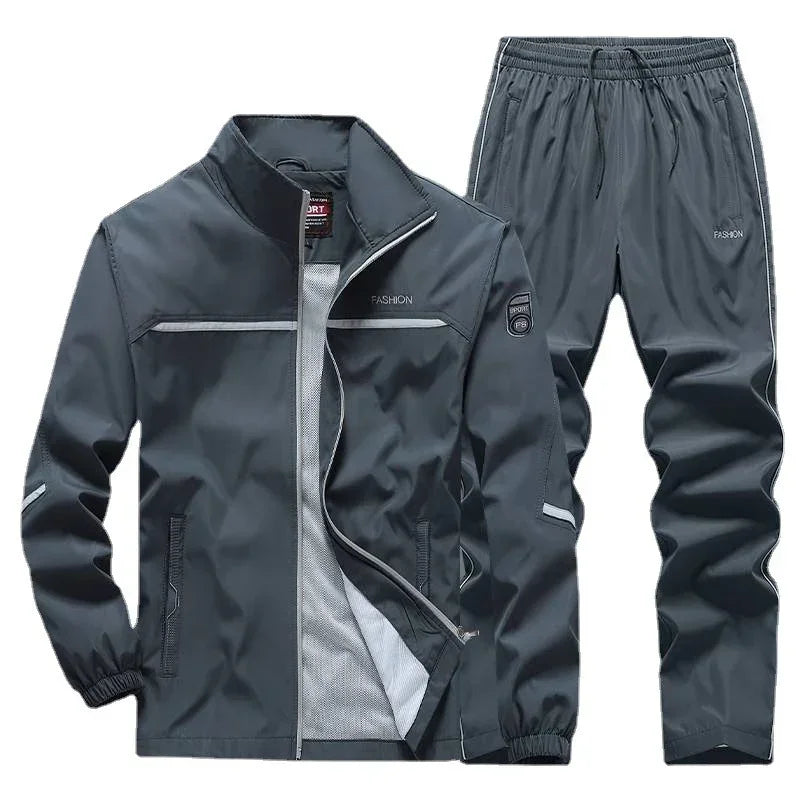 Men's dark gray track suit set with zip-up jacket and elastic waist pants, lightweight fit