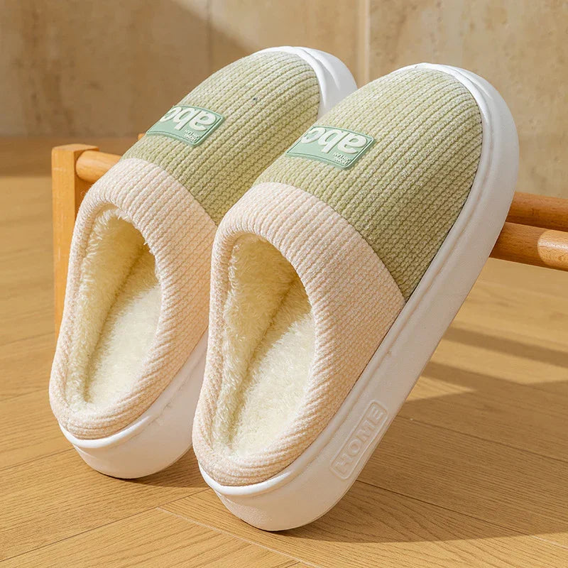 Soft fleece-lined slippers with ribbed knit upper, light green and beige color, slip-on style