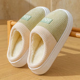 Soft fleece-lined slippers with ribbed knit upper, light green and beige color, slip-on style