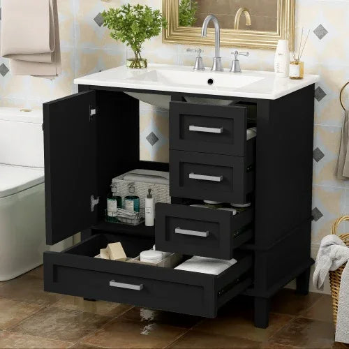 Modern bathroom vanity with black matte cabinets, multiple open drawers, and under-sink storage.