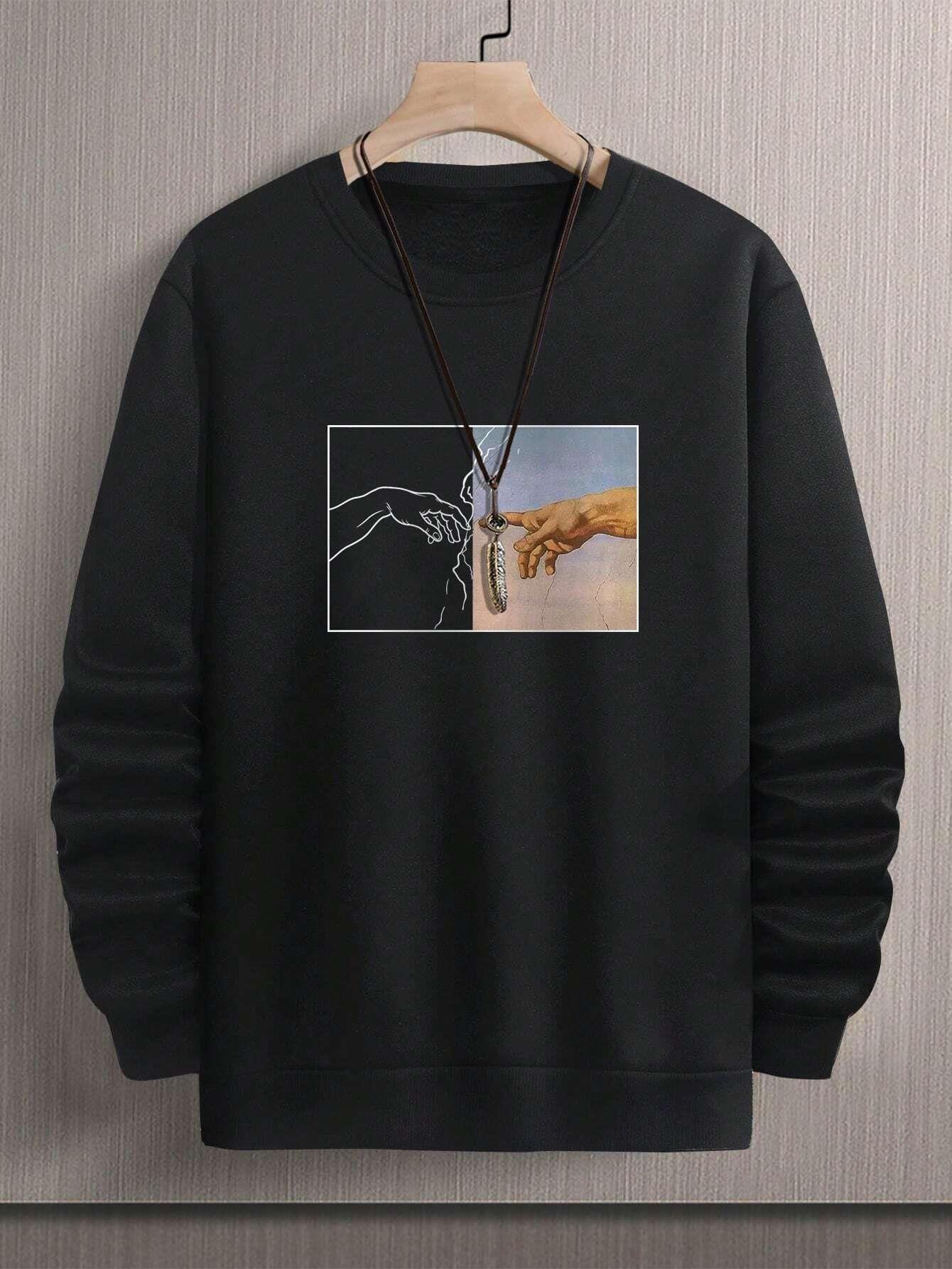 Black crewneck sweatshirt with abstract hand graphic, relaxed fit, soft fabric, unisex streetwear