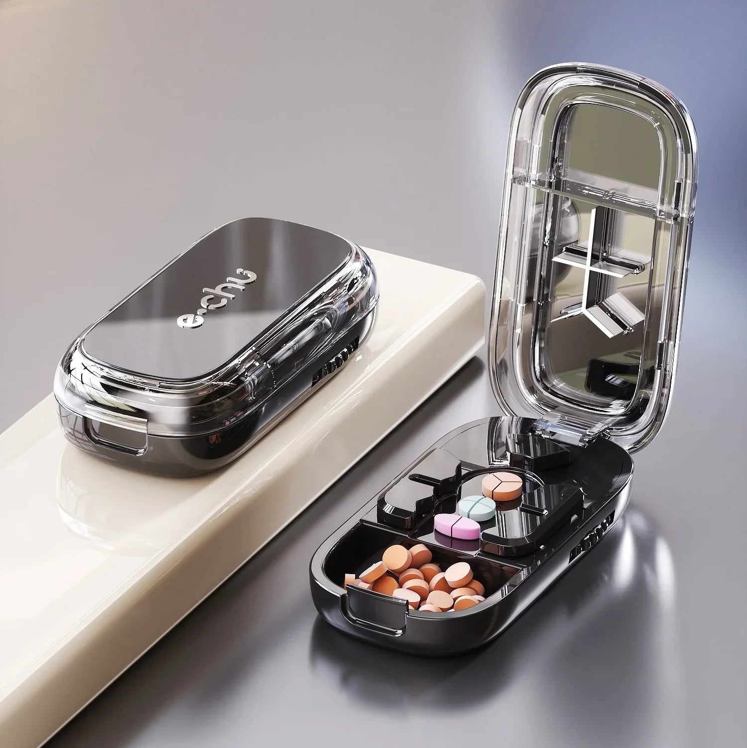 Sleek black pill organizer case with clear lid, mirror, and multiple compartments for tablets