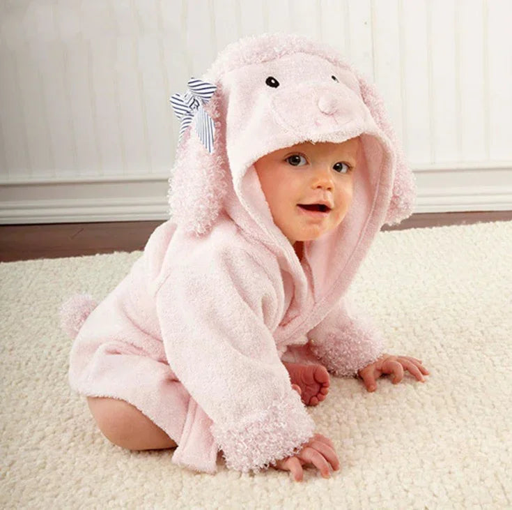 Baby in soft pink hooded romper with animal ears and bow, cozy fleece material, relaxed fit