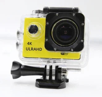Yellow 4K action camera in clear waterproof case, wide lens, mounted on black base
