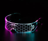 Futuristic LED visor eyewear with hexagonal pattern, glowing pink and blue, acrylic material