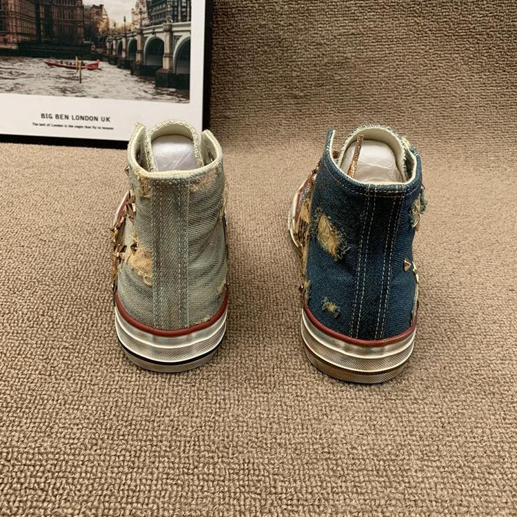 Distressed high-top denim sneakers in light and dark blue with frayed details and relaxed fit