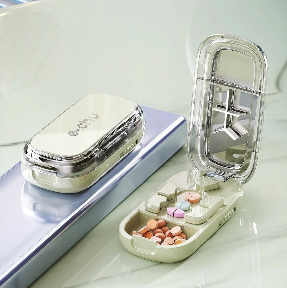 Compact pill organizer in glossy beige plastic with multiple compartments, filled with tablets.