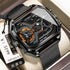 Futuristic black stainless steel dual time watch with mesh band and angular face design