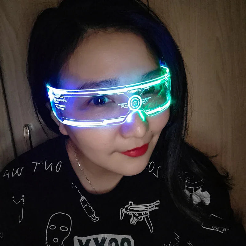 Woman wearing futuristic LED visor glasses and a black graphic streetwear shirt.