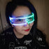 Woman wearing futuristic LED visor glasses and a black graphic streetwear shirt.