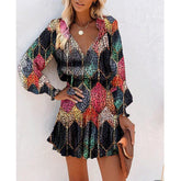 Woman wearing a colorful long sleeve mini dress with leopard print and relaxed fit