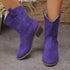 Vibrant purple suede mid-calf western boots with low block heel and embroidered details