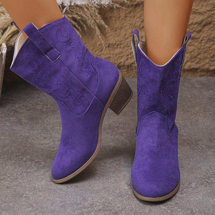 Vibrant purple suede mid-calf western boots with low block heel and embroidered details