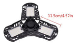 Adjustable black LED ceiling light with three foldable panels, 11.5cm width shown