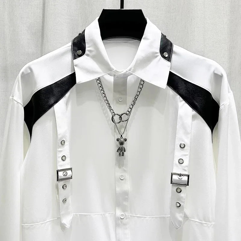 White long sleeve shirt with black faux leather shoulder accents and metal buckle details, modern streetwear style