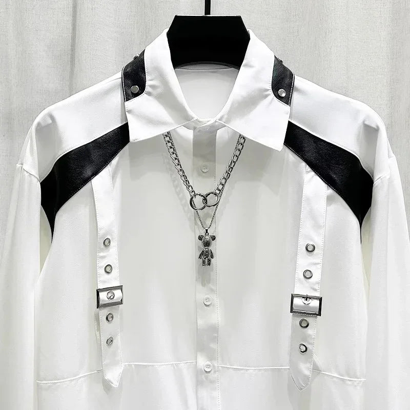 White long sleeve shirt with black faux leather shoulder accents and metal buckle details, modern streetwear style