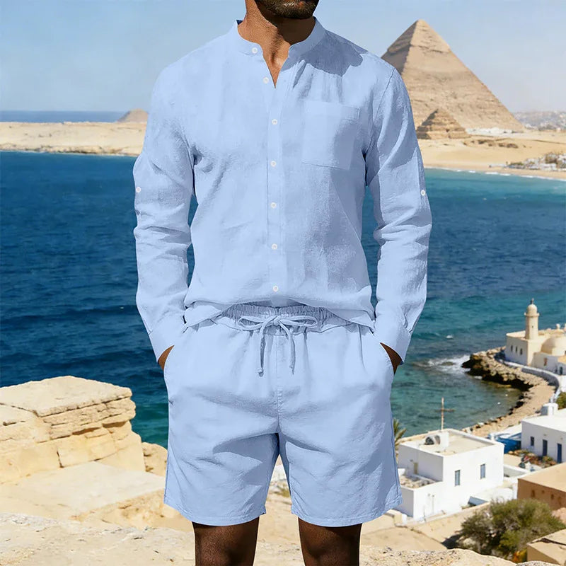 Man wearing light blue linen long-sleeve shirt and drawstring shorts, relaxed fit, summer clothing