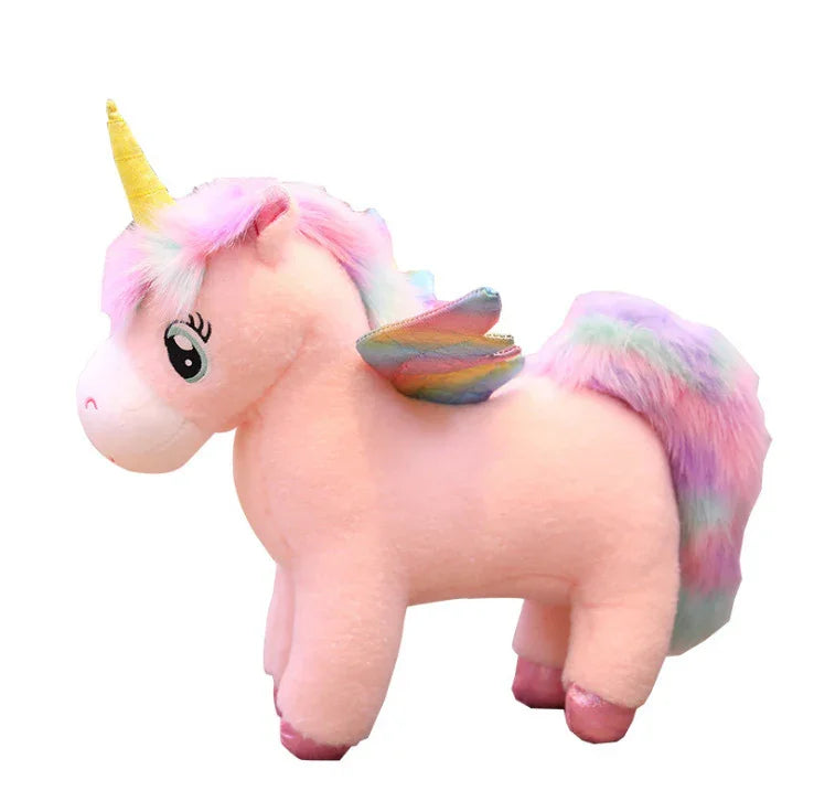Plush light pink unicorn with rainbow mane, pastel wings, and yellow horn, soft fabric toy