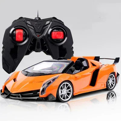 Orange remote control sports car with black controller, sleek aerodynamic design, low-profile fit