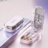 Modern pastel pill organizer case with transparent lid, multiple compartments, and assorted tablets