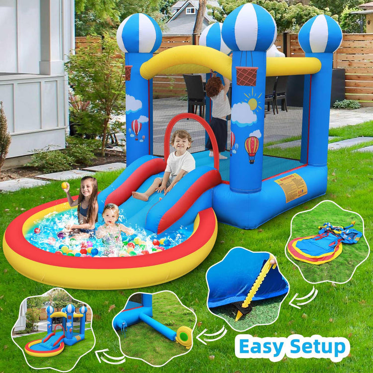 Kids playing in colorful inflatable bounce house with slide and pool in backyard.