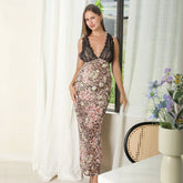 Woman wearing a sleeveless lace and leopard print maxi dress with floral accents, fitted silhouette