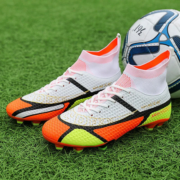 High-top soccer cleats with white, orange, and yellow mesh upper on green field
