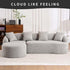 Modern light gray curved sectional sofa with matching throw pillows, upholstered in soft fabric, featuring a relaxed, oversized fit in a minimal living room.