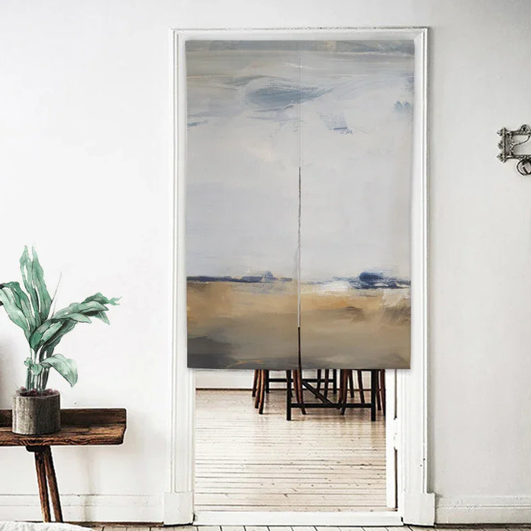 Abstract beige and blue fabric doorway curtain in minimalist white room with wooden furniture