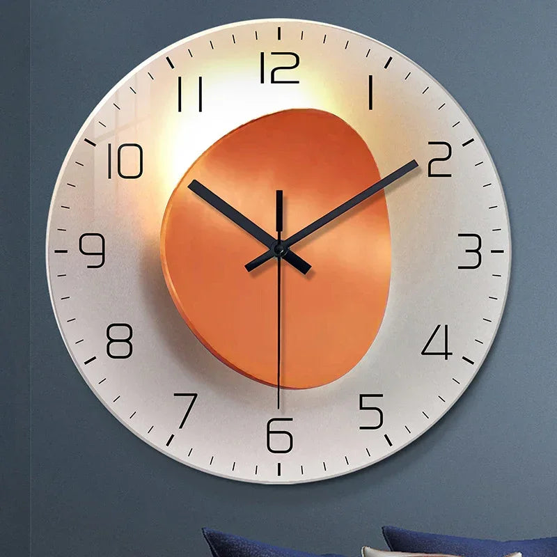 Large modern wall clock with metallic orange accent, minimalist black numbers, sleek hands