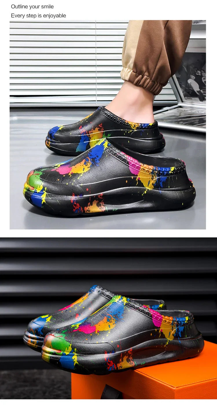 Black slip-on streetwear clogs with colorful paint splatter design, chunky sole, relaxed fit