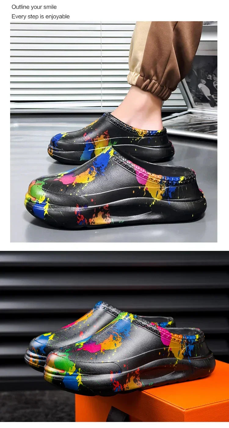 Black slip-on streetwear clogs with colorful paint splatter design, chunky sole, relaxed fit
