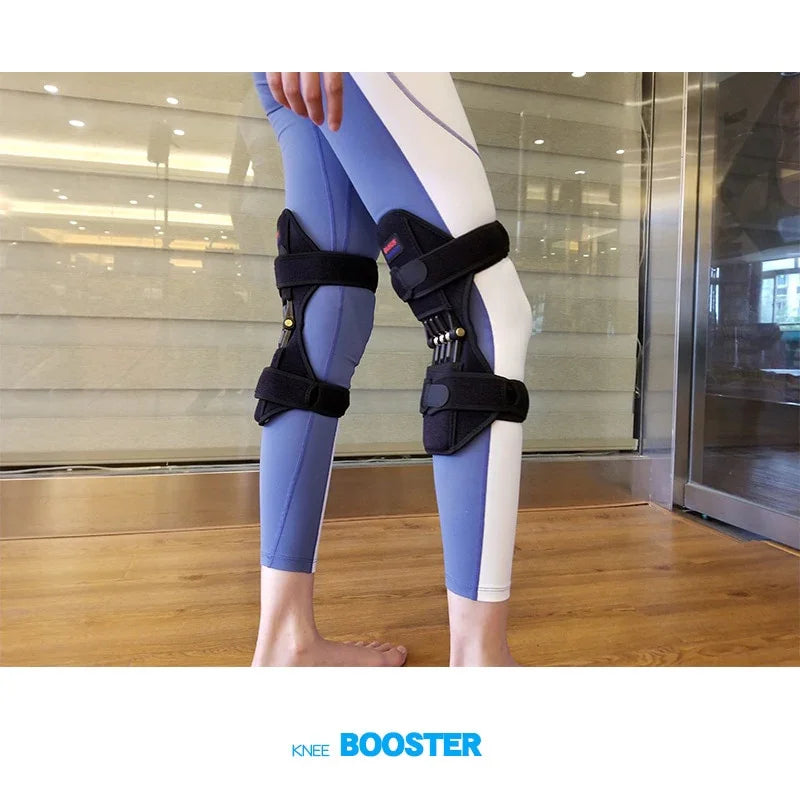 Person wearing black adjustable knee support braces over blue and white fitted leggings