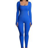 Woman wearing a fitted blue ribbed long sleeve jumpsuit with square neckline