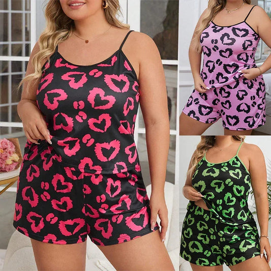 Plus size satin pajama sets in heart print, available in pink, purple, and green, relaxed fit