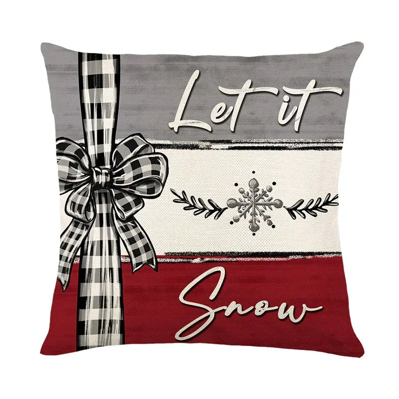 Festive pillow cover with plaid bow, snowflake design, red and gray color blocks, cozy holiday decor.