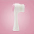 Dual-sided white and pink facial cleansing brush with soft bristles and silicone pad