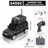 Black remote control camera car toy with camera module, two white trailers, controller, USB accessories, and carrying case.