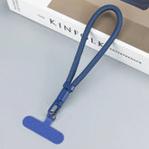 Navy blue woven nylon wrist strap with metal clasp, minimalist tech accessory design