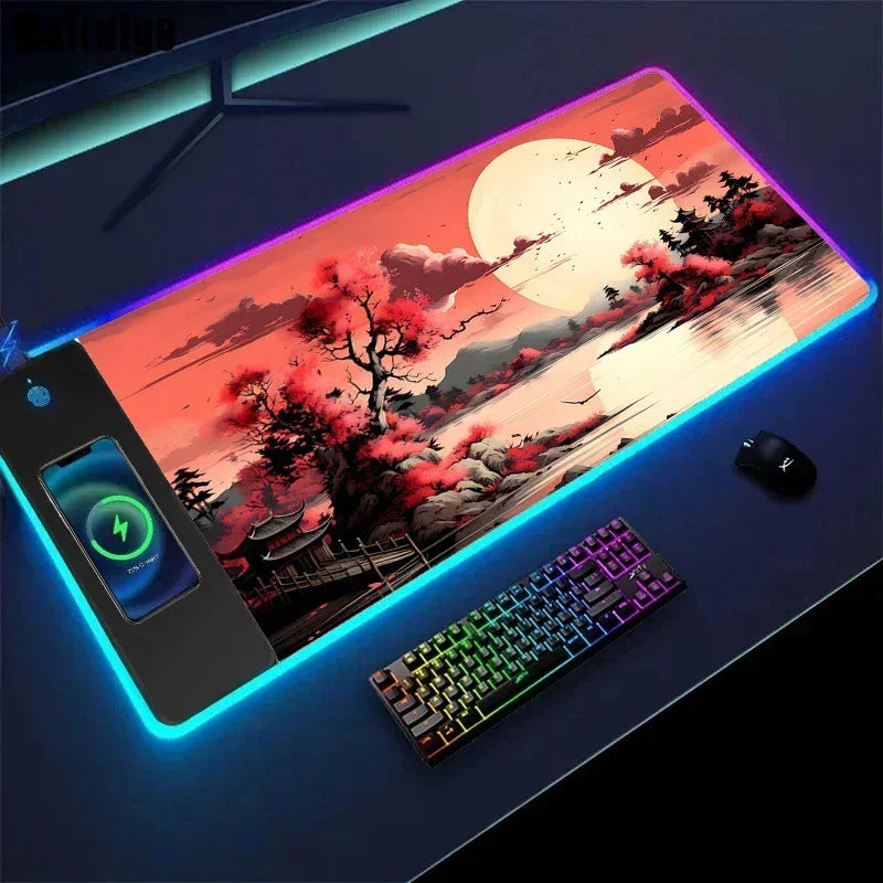 RGB desk mat with vibrant cherry blossom landscape, wireless charging pad, and black gaming accessories
