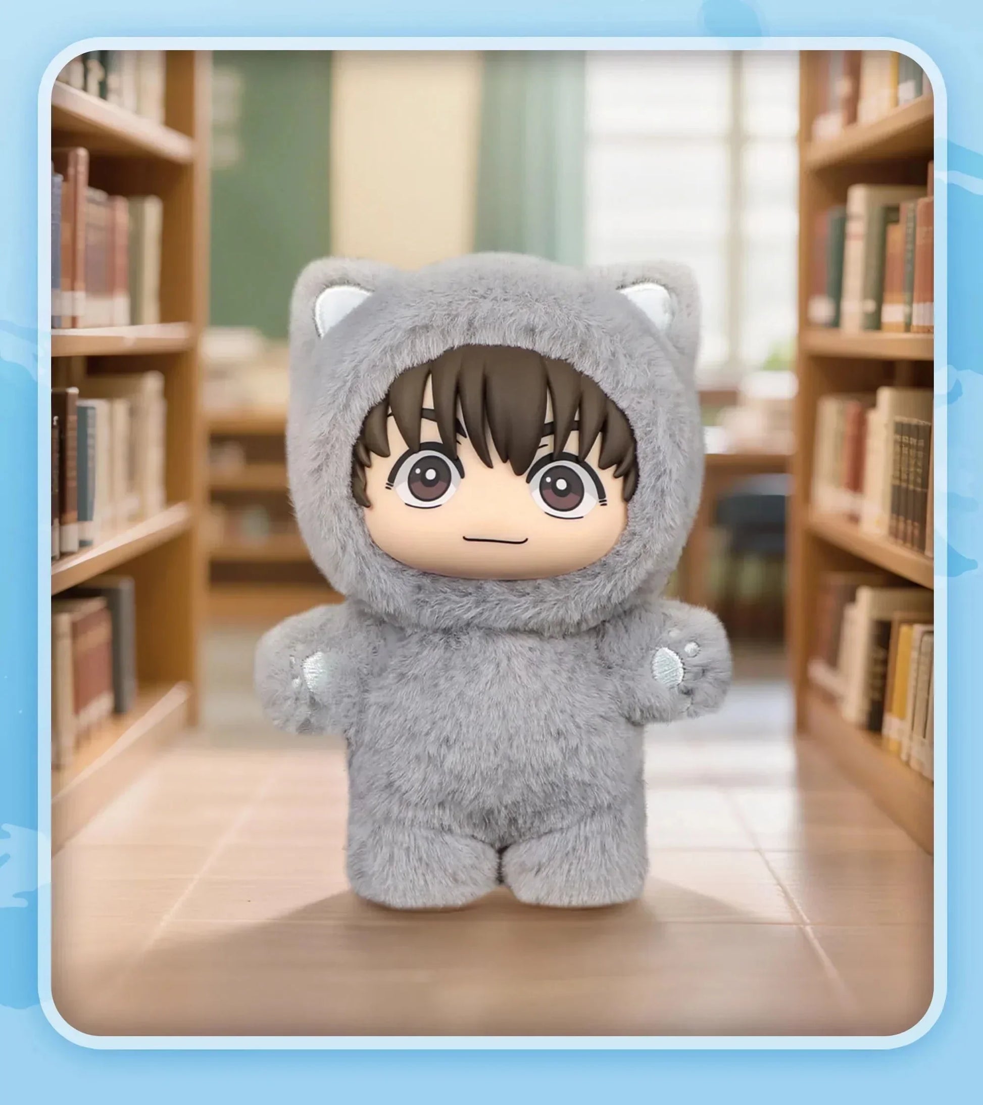 Plush doll in a soft gray faux fur animal onesie with cat ears, relaxed fit, in library aisle
