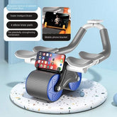 Blue and gray ab roller with knee pads, stable brake, and phone holder on terrazzo base.
