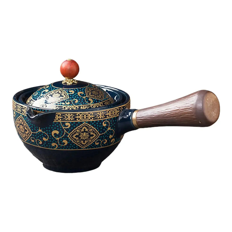 Ornate ceramic saucepan with blue and gold patterns, wooden handle, and matching lid